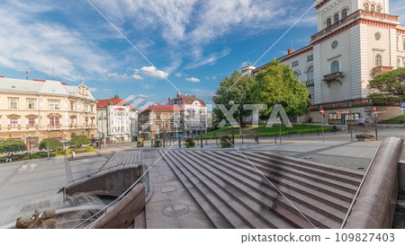 Panorama showing Sulkowski Castle and fountain on Chrobry Square in Bielsko-Biala timelapse, Poland. 109827403