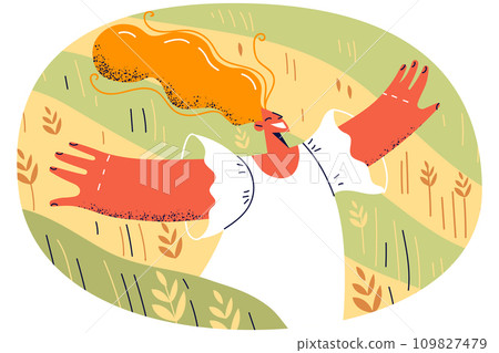 Happy young woman walking in field 109827479