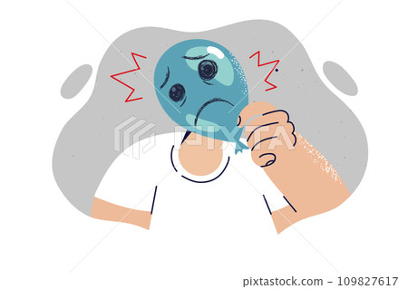 Sad grimace is drawn on balloon and hand man hiding emotions due to psychological crisis and stress Sad grimace is drawn on balloon and hand man hiding emotions due to psychological crisis and stress 109827617