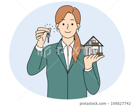 Smiling realtor hold house miniature and key 109827742