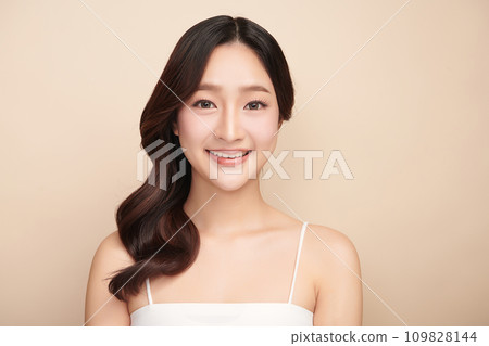 Beautiful young asian woman with clean fresh skin on beige background, Face care, Facial treatment, Cosmetology, beauty and spa, Asian women portrait. Beautiful young asian woman with clean fresh skin on beige background, Face care, Facial treatment, Cosmetology, beauty and spa, Asian women portrait. 109828144
