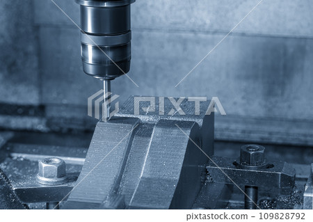 The CNC milling machine cutting mold part by solid ball end mill tool. The CNC milling machine cutting mold part by solid ball end mill tool. 109828792