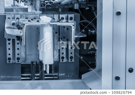 The white bottle container manufacturing process by blow mold machine. 109828794