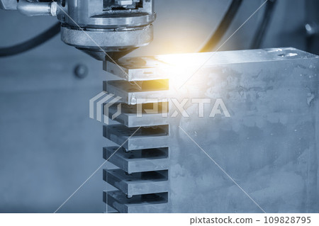 Closeup scene the wire EDM machine cutting the mold insert parts with lighting effect. 109828795