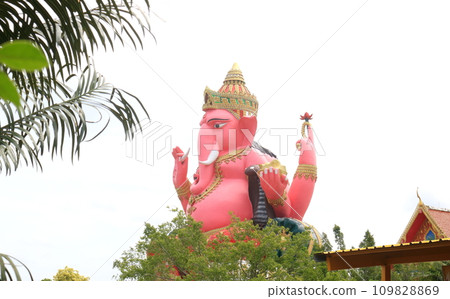 Pink Ganesha statue and white sky background. Pink Ganesha statue and white sky background. 109828869