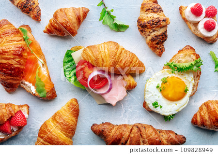 Croissant sandwich assortment. Many stuffed croissants, overhead flat lay 109828949