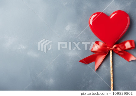 Heart shaped candy on a stick on gray background with copy space. Valentine's Day celebration. AI generated. 109829801