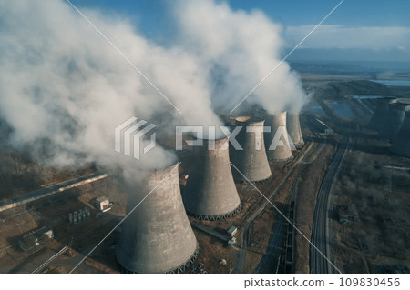Aerial view of an industrial zone pipes pouring thick white smoke. Thick smoke plumes. Thermal power plant pipes, air pollution. Aerial view of an industrial zone pipes pouring thick white smoke. Thick smoke plumes. Thermal power plant pipes, air pollution. 109830456