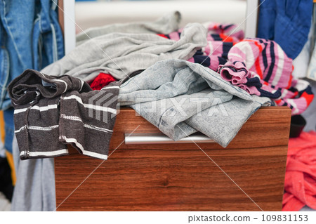 Colorful clothing in the closet at home, closeup 109831153