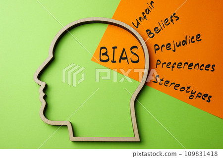 Outline of the head and a sheet of paper with the inscription bias. 109831418