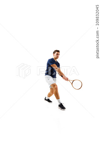 Full-length image of young man, tennis athlete in motion, playing, practicing isolated over white background Full-length image of young man, tennis athlete in motion, playing, practicing isolated over white background 109832045
