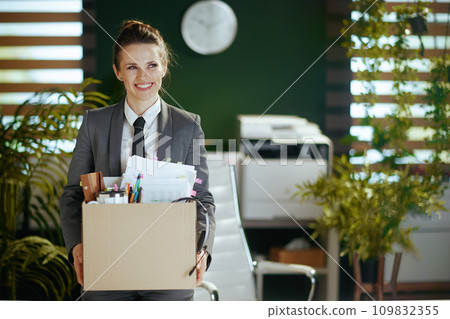 smiling modern female employee in modern green office 109832355