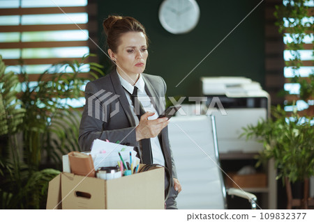 pensive modern woman employee in modern green office pensive modern woman employee in modern green office 109832377