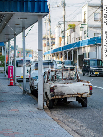 old car parked in a shopping street 109832717