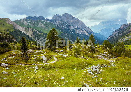 landscape with mountains, hills, clouds, rocks and trees 109832776