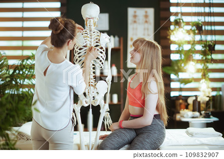 concerned massage therapist woman in massage cabinet concerned massage therapist woman in massage cabinet 109832907