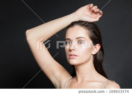 Glamorous healthy brunette woman with clear skin. Skincare, wellness 109833574