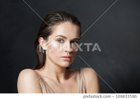 Cute female model with healthy fresh wet skin and dark hair Cute female model with healthy fresh wet skin and dark hair 109833590