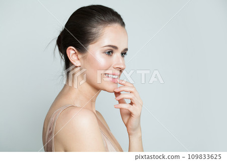 Cheerful happy woman with beauty face and healthy facial skin close up portrait. 109833625