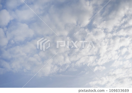 white fluffy clouds in the blue sky 109833689