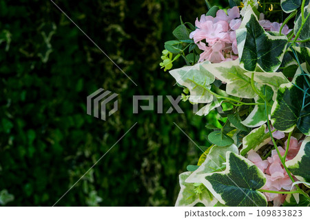 frame of artificial flowers and green leaves background. nature concept, tropical leaf frame of artificial flowers and green leaves background. nature concept, tropical leaf 109833823