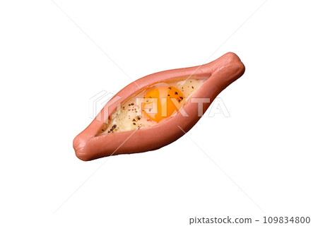 Composite concept of fried eggs inside a cut sausage with spices 109834800