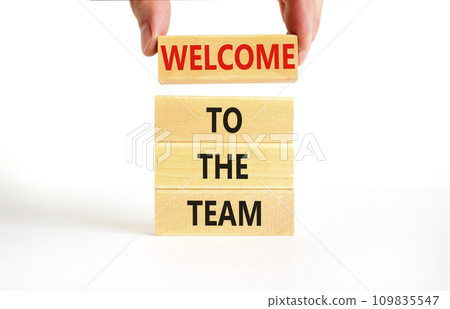 Welcome to the team symbol. Concept words Welcome to the team on wooden block. Beautiful white table white background. Businessman hand. Business, motivational and welcome to the team concept. Welcome to the team symbol. Concept words Welcome to the team on wooden block. Beautiful white table white background. Businessman hand. Business, motivational and welcome to the team concept. 109835547