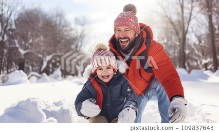 Dad and son share giggles, snowball tosses, and snowy adventures Dad and son share giggles, snowball tosses, and snowy adventures 109837643