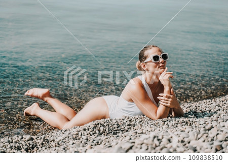 Woman white bikini beach tan. Happy woman in swimwear on vacation. Summer travel holidays vacation on the sea Woman white bikini beach tan. Happy woman in swimwear on vacation. Summer travel holidays vacation on the sea 109838510