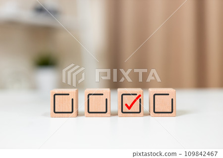 Wooden cubes with check mark icon. Human resource. Quality Control. Task list goals success Wooden cubes with check mark icon. Human resource. Quality Control. Task list goals success 109842467