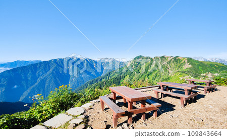 Climbing Mt. Jijigatake in summer (view of Mt. Harinoki and Mt. Renge from Taneike Sanso) Climbing Mt. Jijigatake in summer (view of Mt. Harinoki and Mt. Renge from Taneike Sanso) 109843664