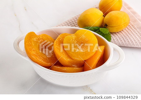 Few canned aprocots in the bowl Few canned aprocots in the bowl 109844329