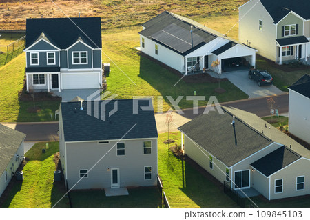 Aerial view of tightly located new family houses in South Carolina suburban area. Real estate development in american suburbs 109845103