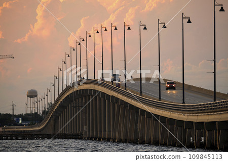 Barron Collier Bridge and Gilchrist Bridge in Florida with moving traffic. Transportation infrastructure in Charlotte County connecting Punta Gorda and Port Charlotte over Peace River 109845113