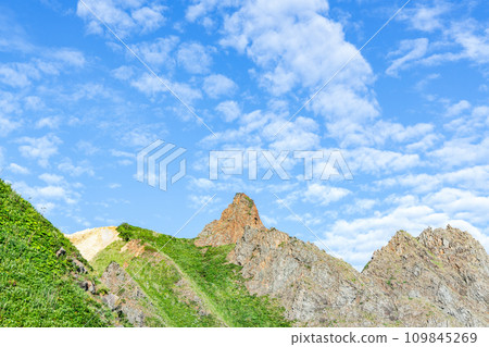 Steep mountains and blue sky (mountain image) 109845269