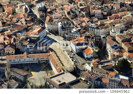 Aerial view of dense historic center of Thiers town in Puy-de-Dome department, Auvergne-Rhone-Alpes region in France. Rooftops of old buildings and narrow streets 109845962