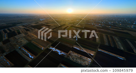 Aerial view of plowed agricultural field prepared for planting crops in spring 109845979