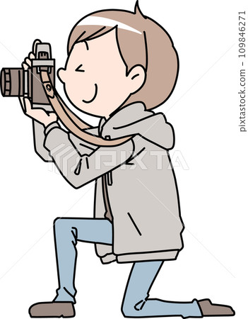 A man holding a camera 109846271