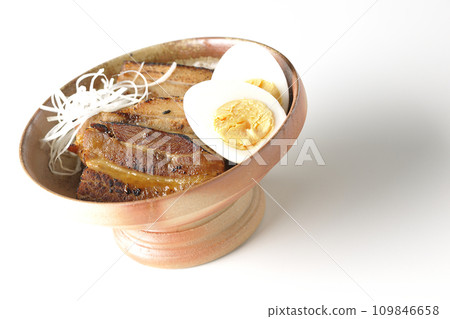 Thickly sliced char siu topped with white onion and boiled egg photographed against a white background Thickly sliced char siu topped with white onion and boiled egg photographed against a white background 109846658