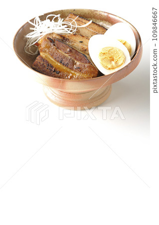 Thickly sliced char siu topped with white onion and boiled egg photographed against a white background 109846667