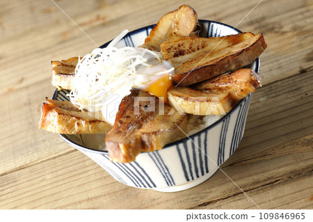 Thick-sliced char siu bowl topped with soft-boiled egg Thick-sliced char siu bowl topped with soft-boiled egg 109846965