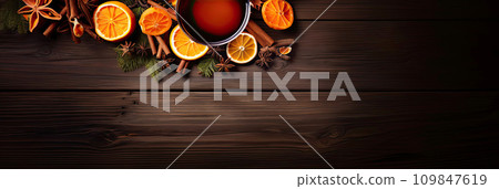Fragrant Ingredients for mulled wine in glasses with cinnamon, orange slice and spices, anise, fir branches on wooden table with space for text, top view. AI generated 109847619
