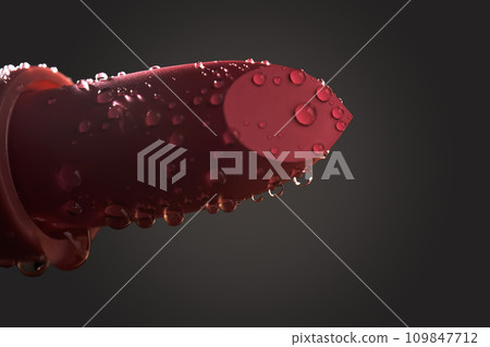 Red lipstick with water drops on a dark background. 109847712