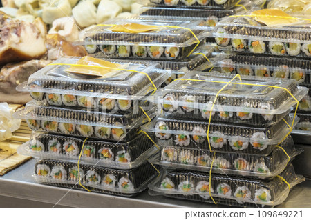 Packs of seaweed rolls lined up at a market stall 109849221