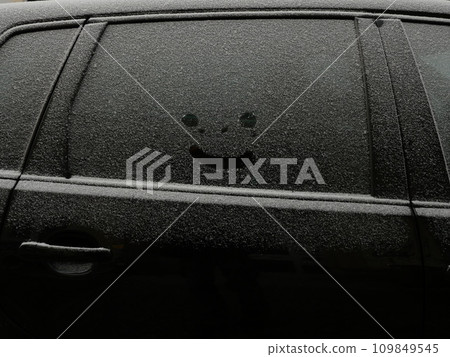 smiley in snow on car window smiley in snow on car window 109849545