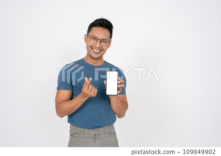 A positive Asian man is showing a smartphone to the camera, isolated white background. A positive Asian man is showing a smartphone to the camera, isolated white background. 109849902