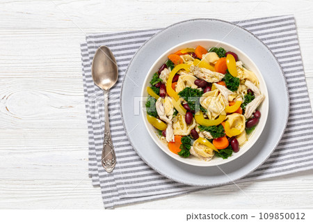 chicken minestrone soup with tortelloni in bowl chicken minestrone soup with tortelloni in bowl 109850012