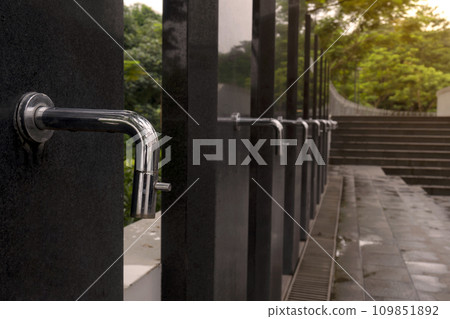 A row of water tap ablution places for Muslims A row of water tap ablution places for Muslims 109851892
