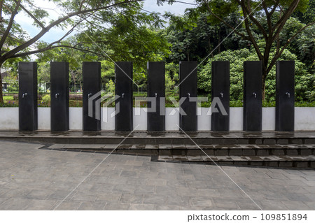 A row of water tap ablution places for Muslims A row of water tap ablution places for Muslims 109851894