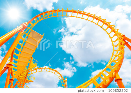 Rollercoaster railroad track high to the sky roll bend and twist for exciting fun at theme park Rollercoaster railroad track high to the sky roll bend and twist for exciting fun at theme park 109852202